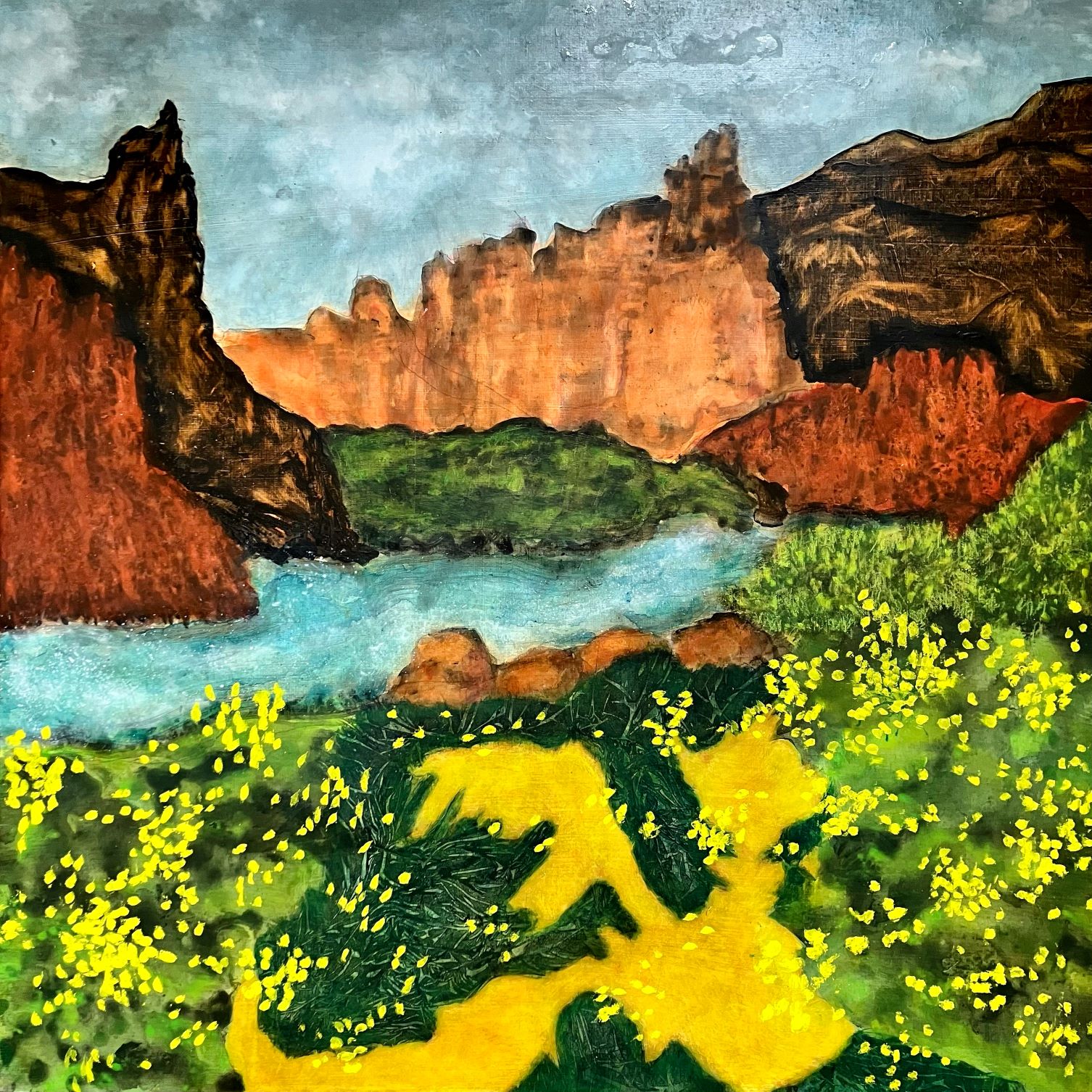 Canyon mountains, river, grassy fields with yellow flowers