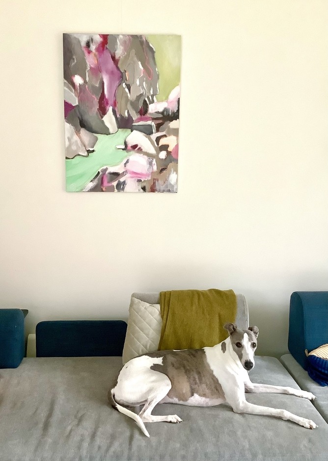 Picture of painting with dog on sofa